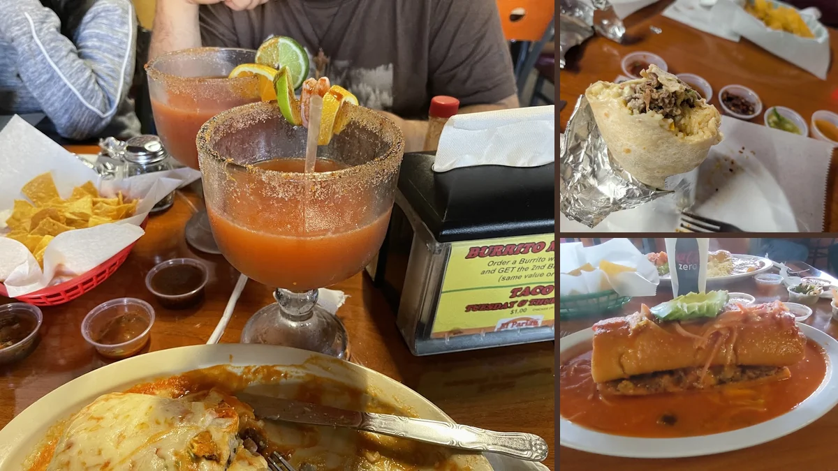 A table with chips, salsa, and fresh dishes.
