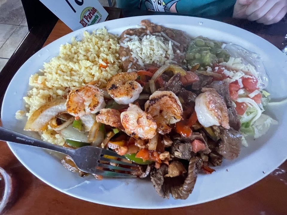 Breakfast plates and quesadillas listed on menu.