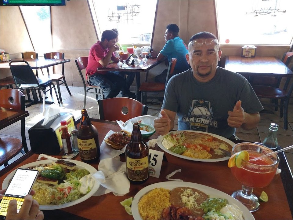 Taquería menu with sides and breakfast options.