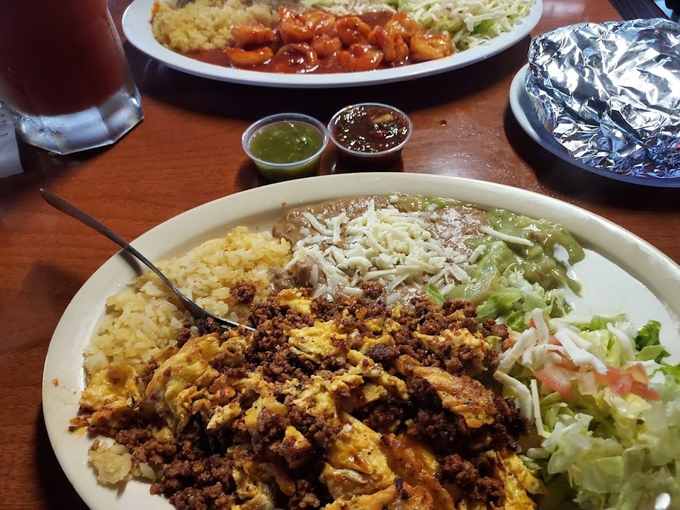 Taquería menu with sides and breakfast options.